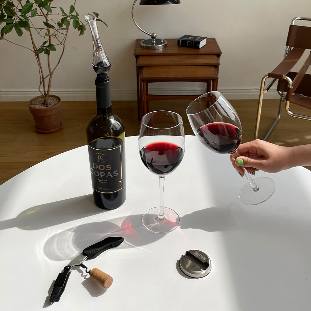 Vintorio Wine Aerator Pourer with red wine glasses, corkscrew, and metal foil cutter